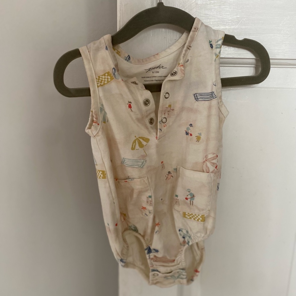 Adorable Cream Baby Romper with Playful Beach Print